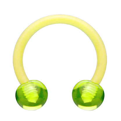 An acrylic horseshoe green earring with a ball on each end pictured against a white background.