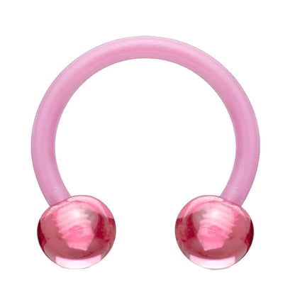 An acrylic horseshoe pink earring with a ball on each end pictured against a white background.