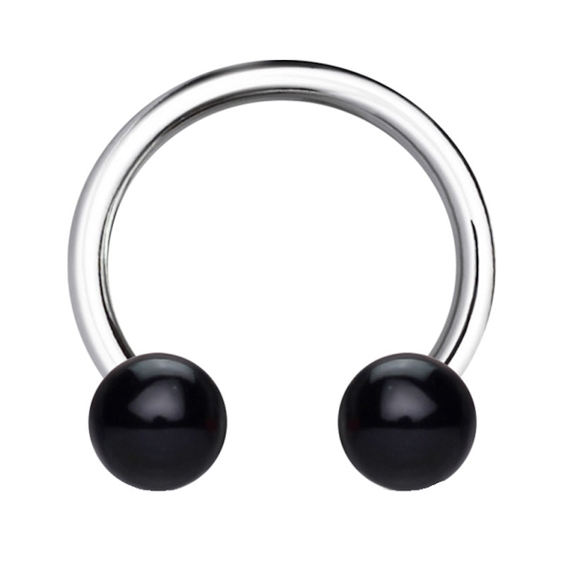 A black balls 16 gauge earring pictured against a white background.