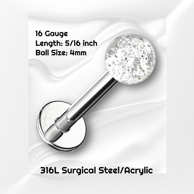 A clear glitter labret earring pictured against a white wavy background with black text stating the size available of this labret earring.