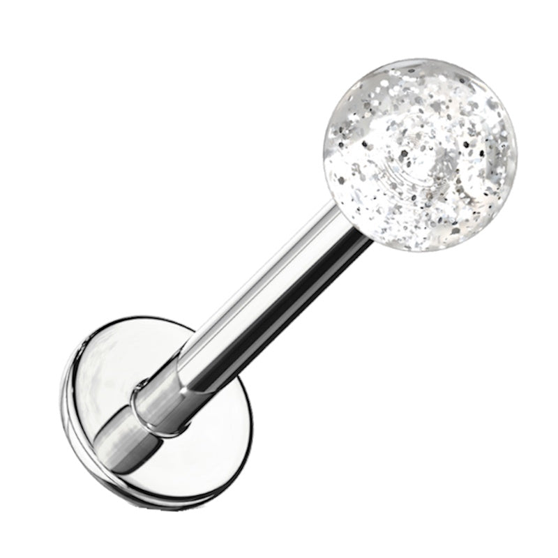 A clear glitter labret earring pictured against a white background.