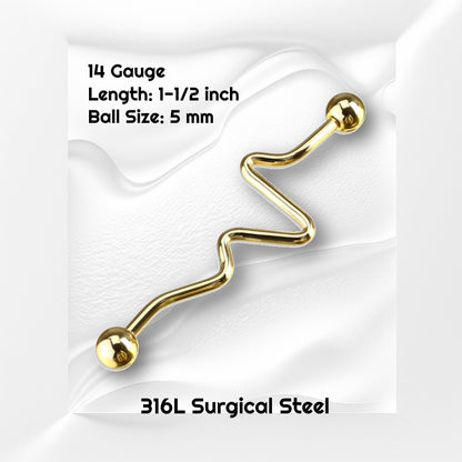 A gold plated zig zag industrial bar pictured on a white wavy background with black text stating the size available of this industrial barbell.