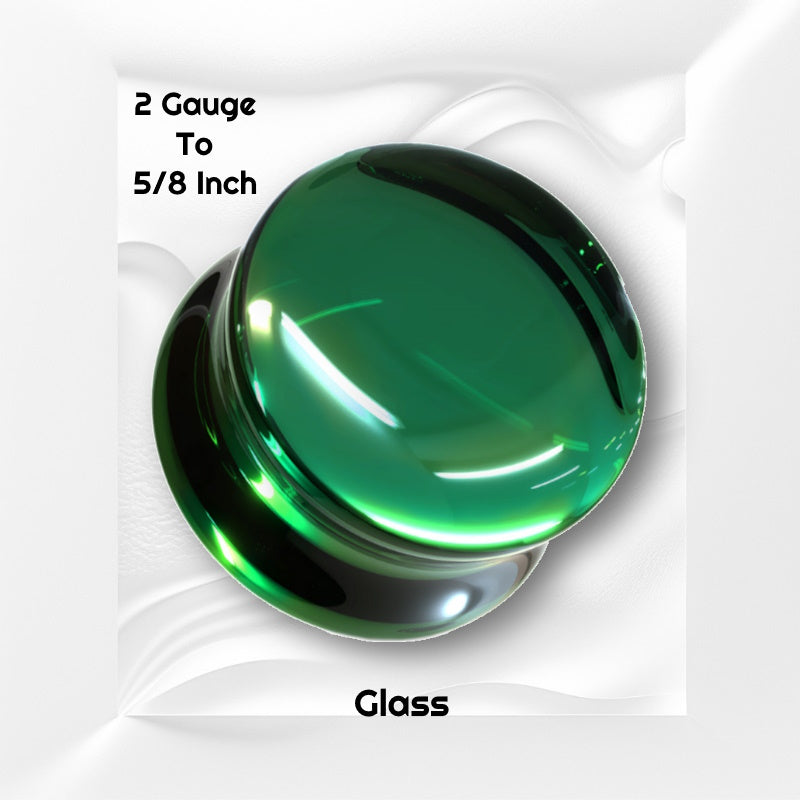 One of a pair of green glass gauge earrings pictured on a white wavy background with black text stating the sizes available of this gauge earring.