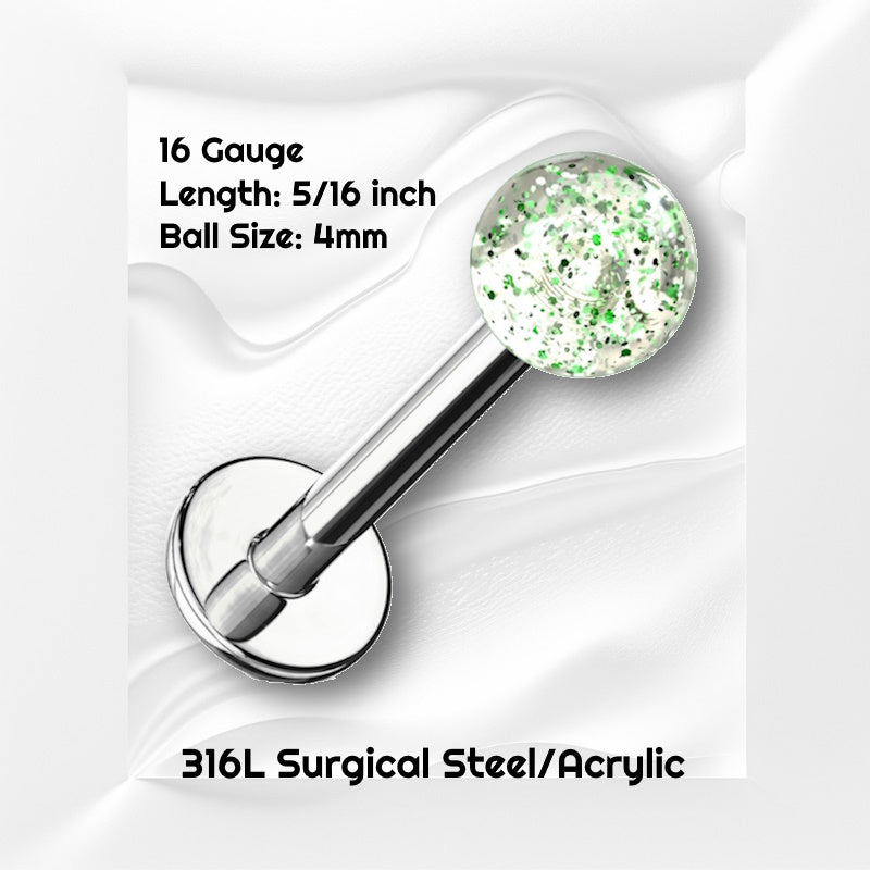 A green glitter labret earring pictured against a white wavy background with black text stating the size available of this labret earring.