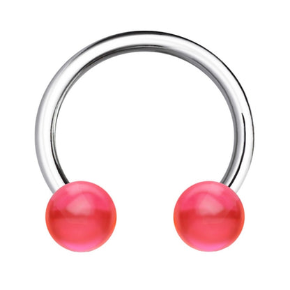 A pink balls 16 gauge earring pictured against a white background.