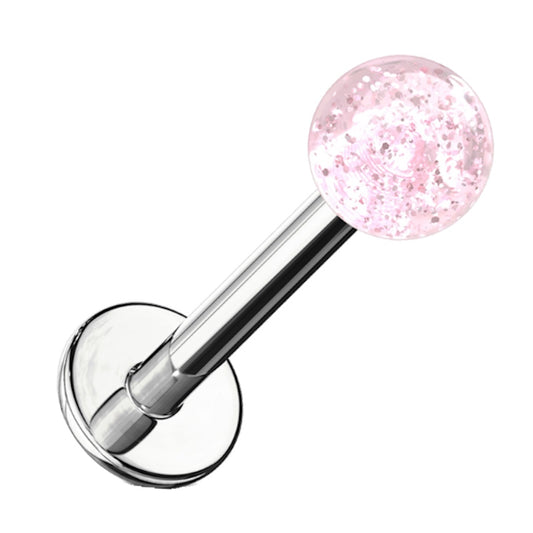 A pink glitter labret earring pictured against a white background.