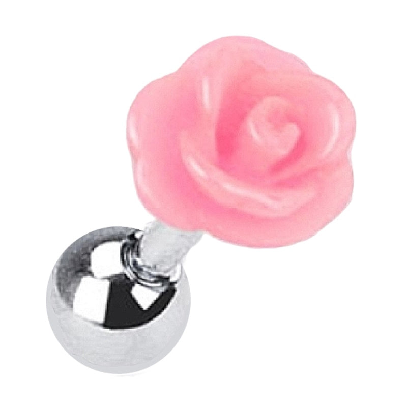 A pink rose cartilage earring pictured diagonally against a white background.