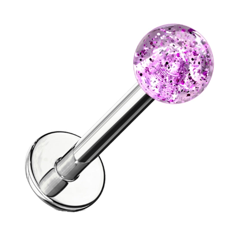 A purple glitter labret earring pictured against a white background.