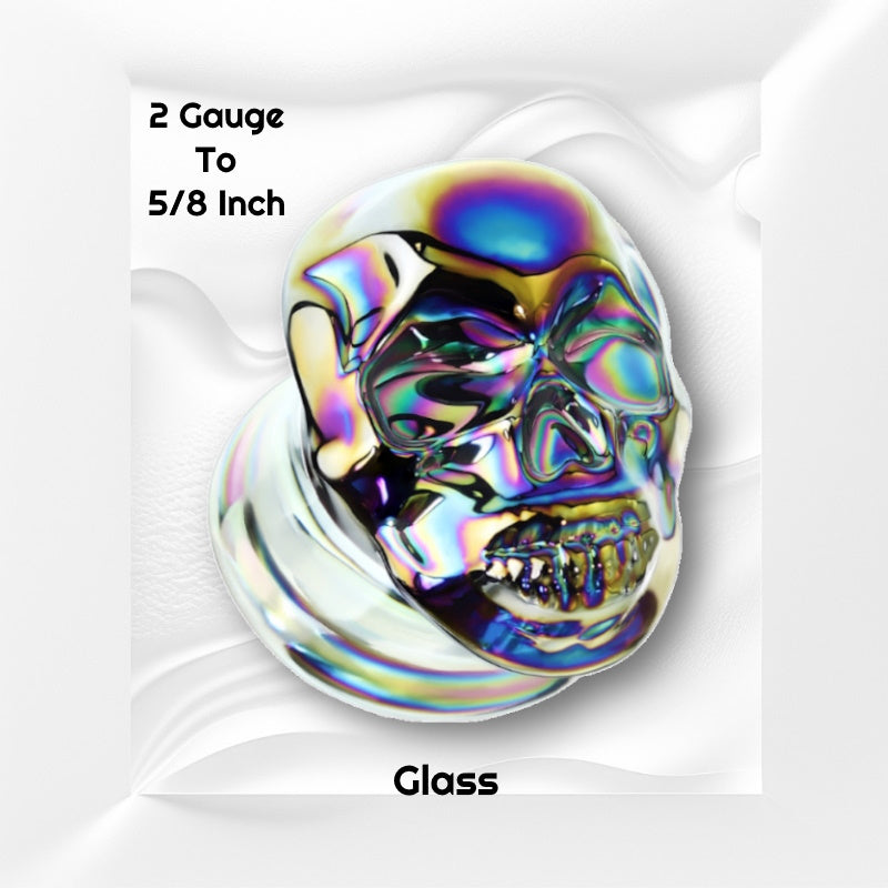 One of a pair of pyrex glass skull gauges with a multicolor rainbow finish pictured on a white wavy background with black text stating the sizes available of this gauge earring.