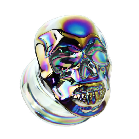 One of a pair of pyrex glass skull gauges with a multicolor rainbow finish pictured against a white background.