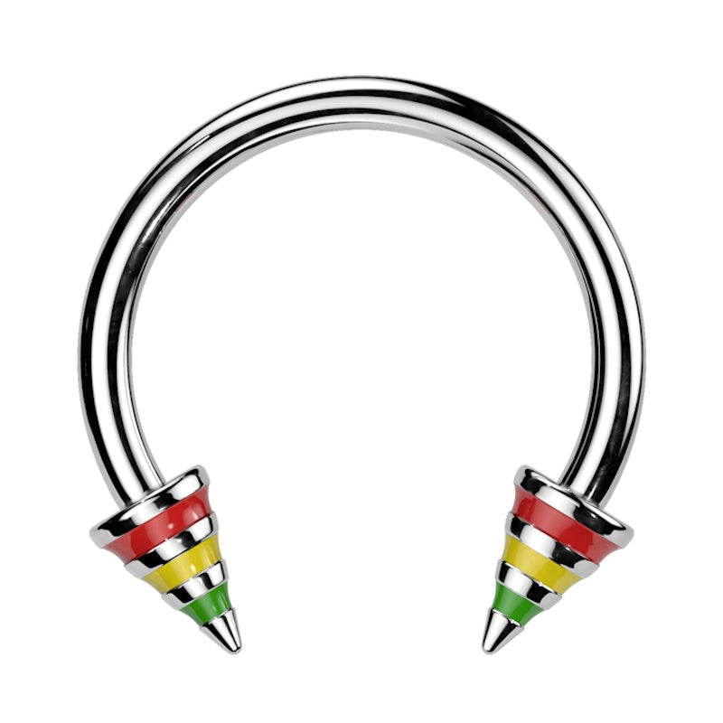 A rasta stripe horseshoe barbell featuring spikes with red, yellow, and green stripes on the ends of the circular barbell pictured against a white background.