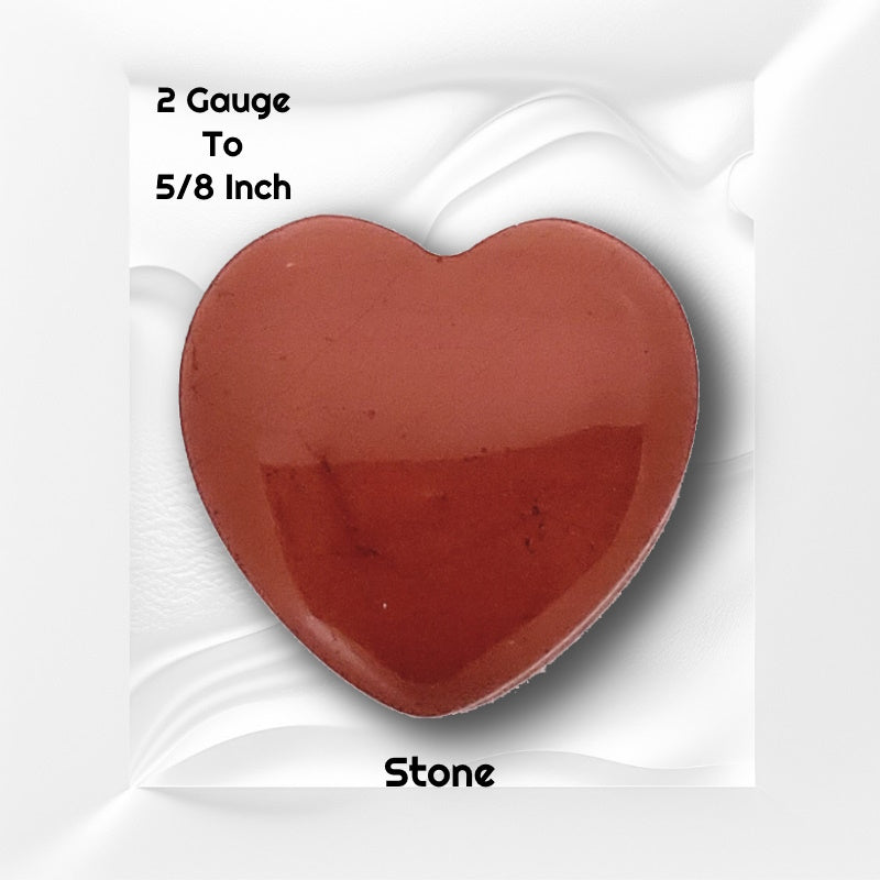 One of a pair of red jasper heart gauges pictured on a white wavy background with black text stating the sizes available of this gauge earring.