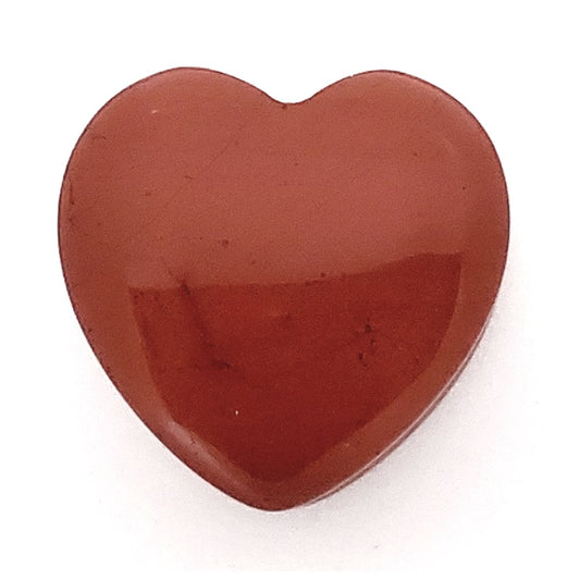 One of a pair of red jasper heart gauges featuring a brownish toned surface pictured against a white background.