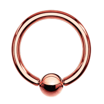 A rose gold captive bead ring pictured against a white background.