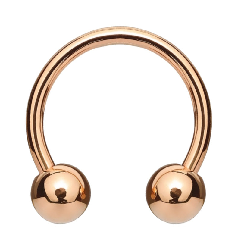 A rose gold circular barbell earring pictured against a white background.