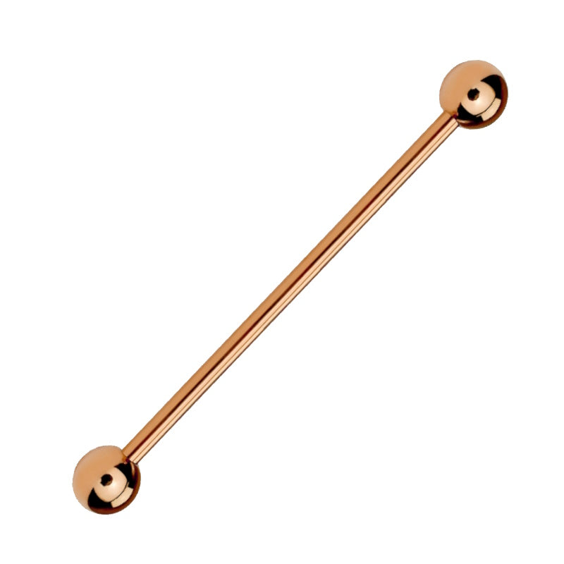 A rose gold industrial earring pictured against a white background.