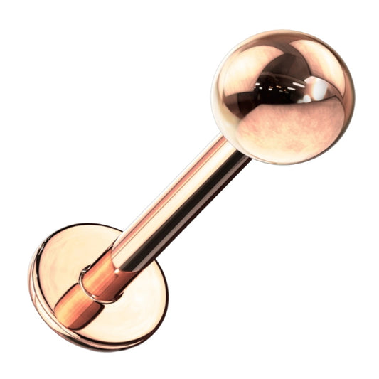 A rose gold labret earring pictured against a white backbround.