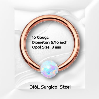 A rose gold opal earring pictured against a white wavy background with black text stating the size of this earring.