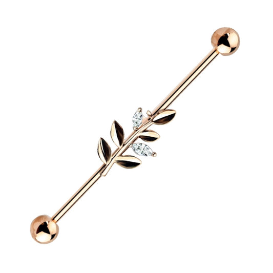 A rose gold vine industrial earring pictured against a white background.