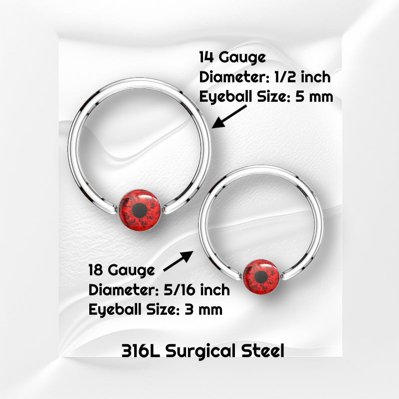 A surgical steel red eyeball earring featuring a captive red eyeball bead pictured against white wavy background with black text stating the size available of this horseshoe earring.